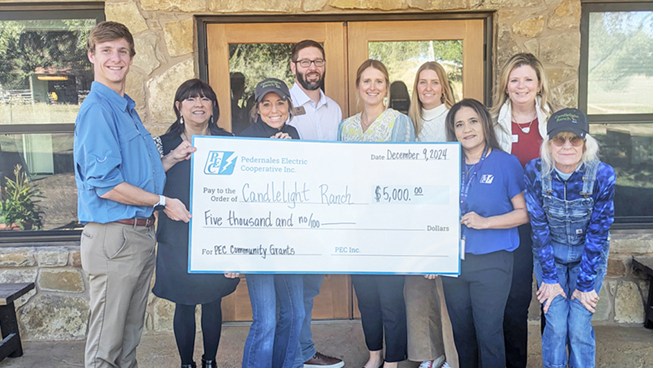 Photo of PEC employees with representatives from the Candlelight Ranch organization.
