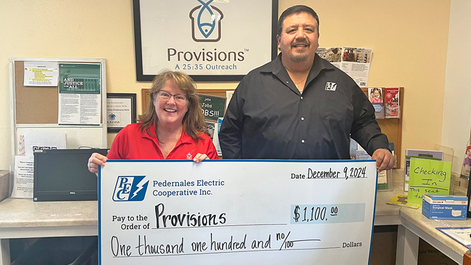 Photo of PEC employee with a representative from Provisions organization.