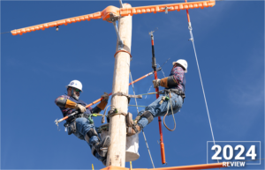 PEC journeyworkers David Hernandez and Darren Donhauser work together during the International Lineman's Rodeo at Bonham Springs, Kansas, in October of 2024.